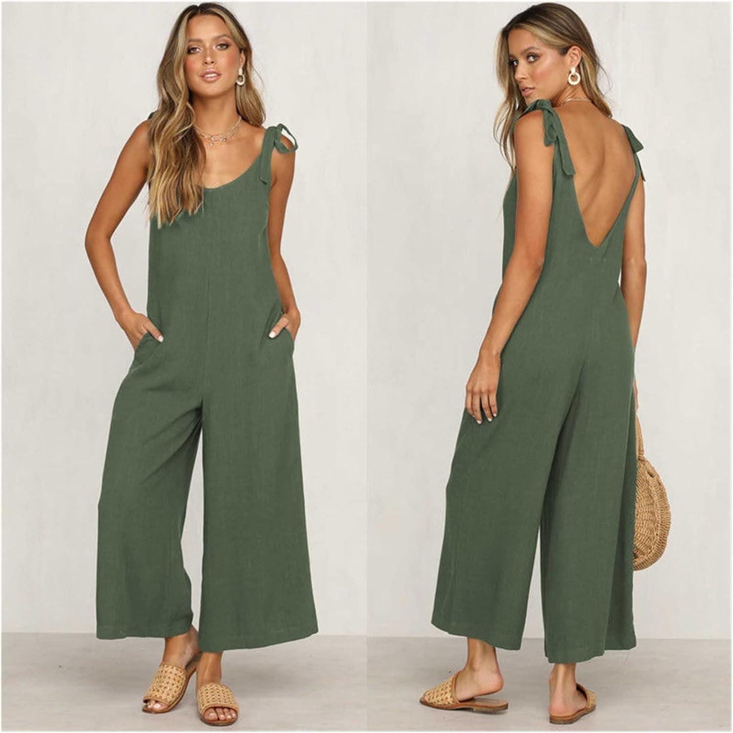 Woman wearing a green jumpsuit with a plain background