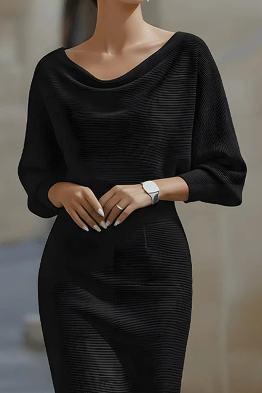 Person wearing a black outfit with a blurred background