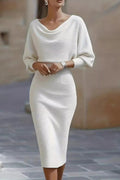 Woman wearing a white dress with a blurred background