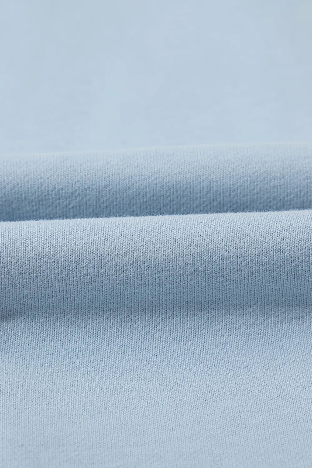 Close-up of light blue fabric texture