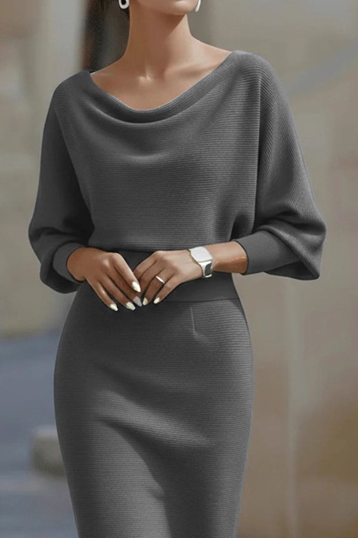 woman wearing a gray dress with a blurred background